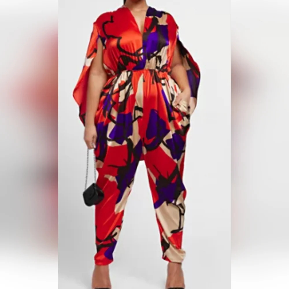 Gabrielle Union Vibrant Red and Blue Caped Jumpsuit with Abstract Print